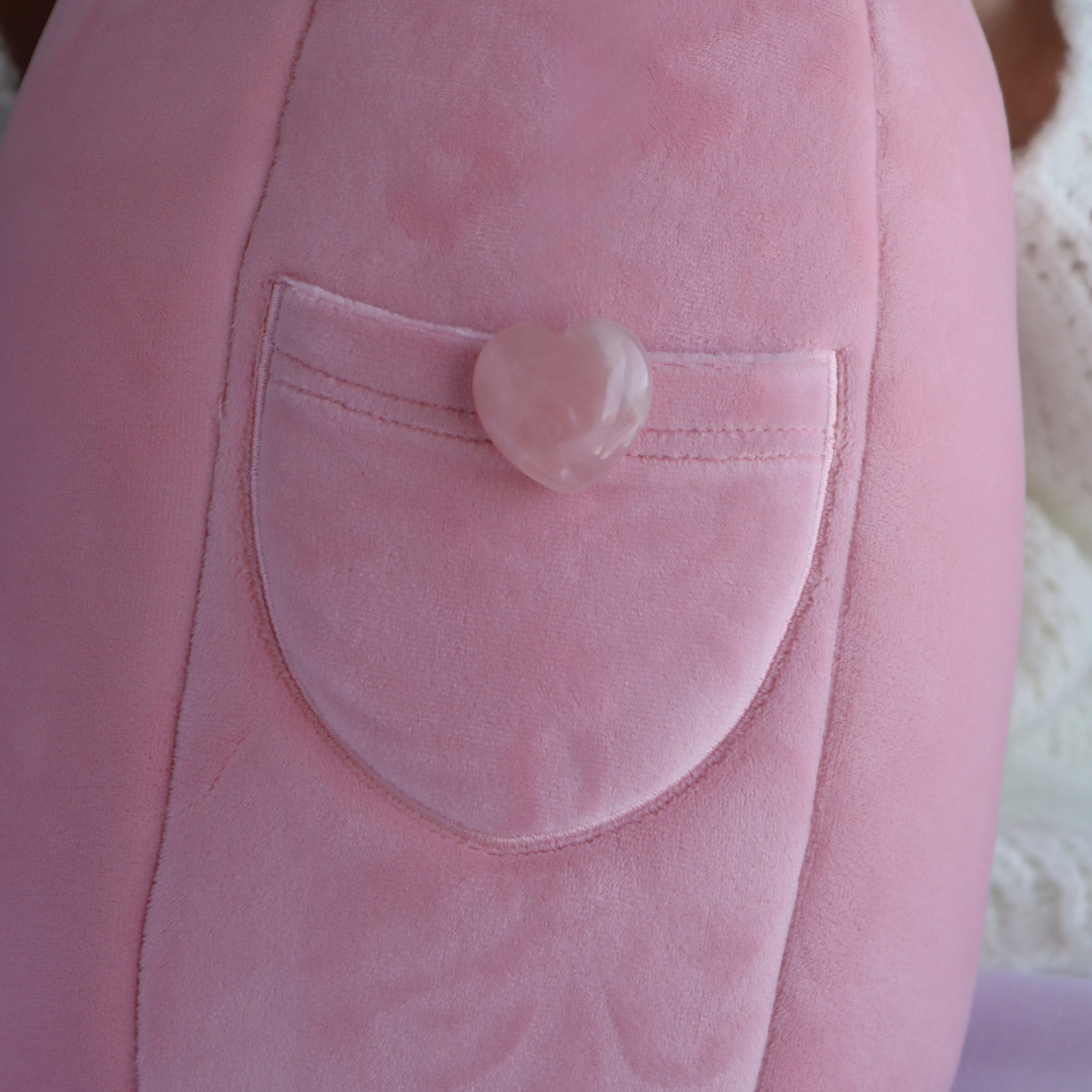 The rose quartz heart in the back pocket of Rosie the Rose Quartz Crystal Plushie