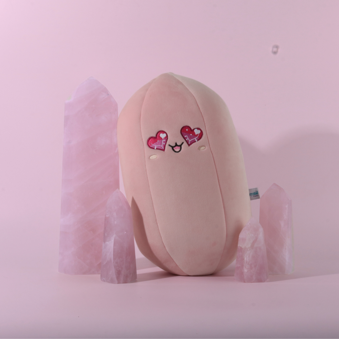 Rosie the Rose Quartz, a pink 14 inch Crystal Plushie with heart eyes